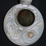 View the image:  Sterling silver and 14k eye Frog wiith Unikite stone